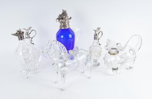 A PAIR OF VICTORIAN SILVER MOUNTED GLASS OIL AND VINEGAR CONDIMENT BOTTLES AND FOUR FURTHER ITEMS (6)