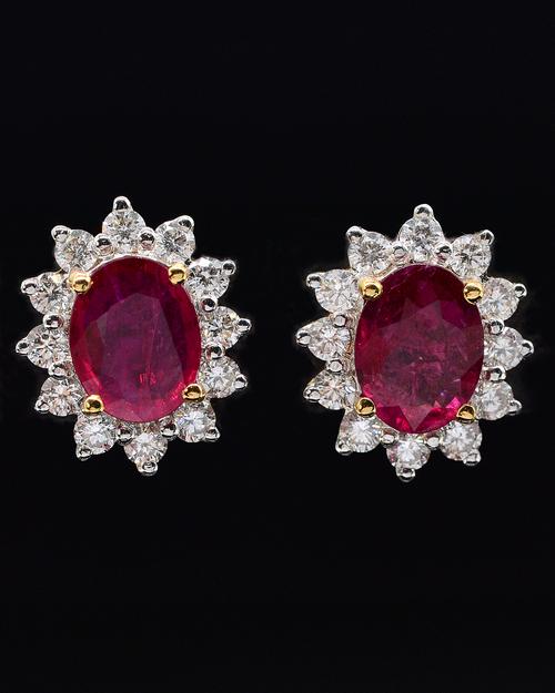 A PAIR OF RUBY AND DIAMOND CLUSTER EARRINGS