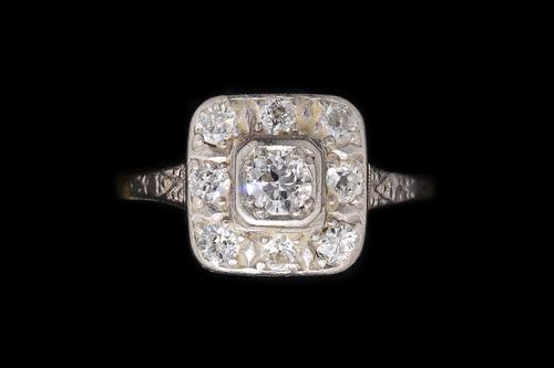 AN ART DECO DIAMOND CLUSTER RING