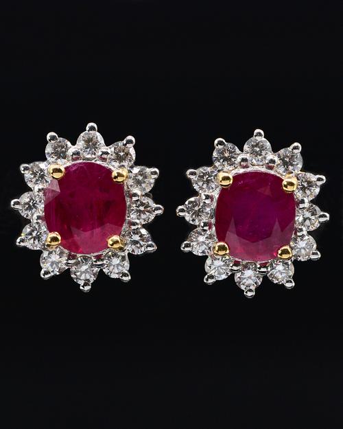 A PAIR OF RUBY AND DIAMOND CLUSTER EARRINGS
