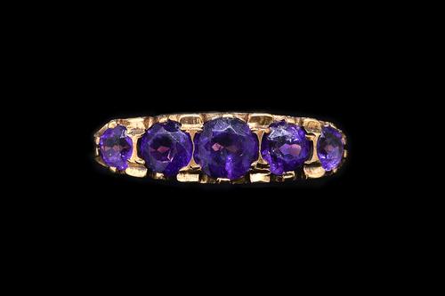 AN AMETHYST FIVE STONE RING