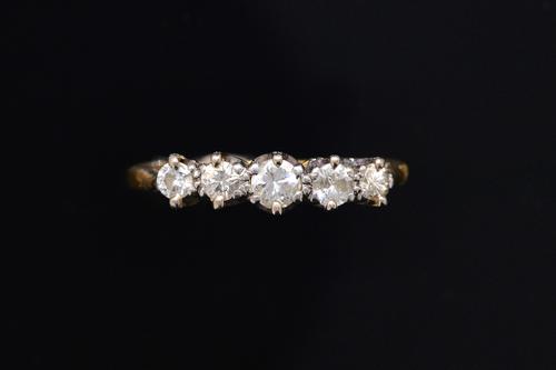 A DIAMOND FIVE STONE RING