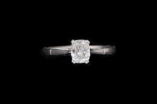 A CUSHION CUT DIAMOND SINGLE STONE RING