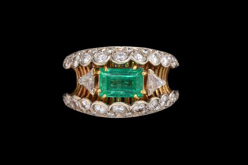 A EMERALD AND DIAMOND DRESS RING