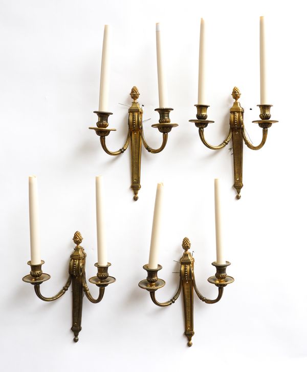 A SET OF FOUR NEO-CLASSICAL STYLE GILT-METAL TWIN LIGHT WALL APPLIQUÉS (4)