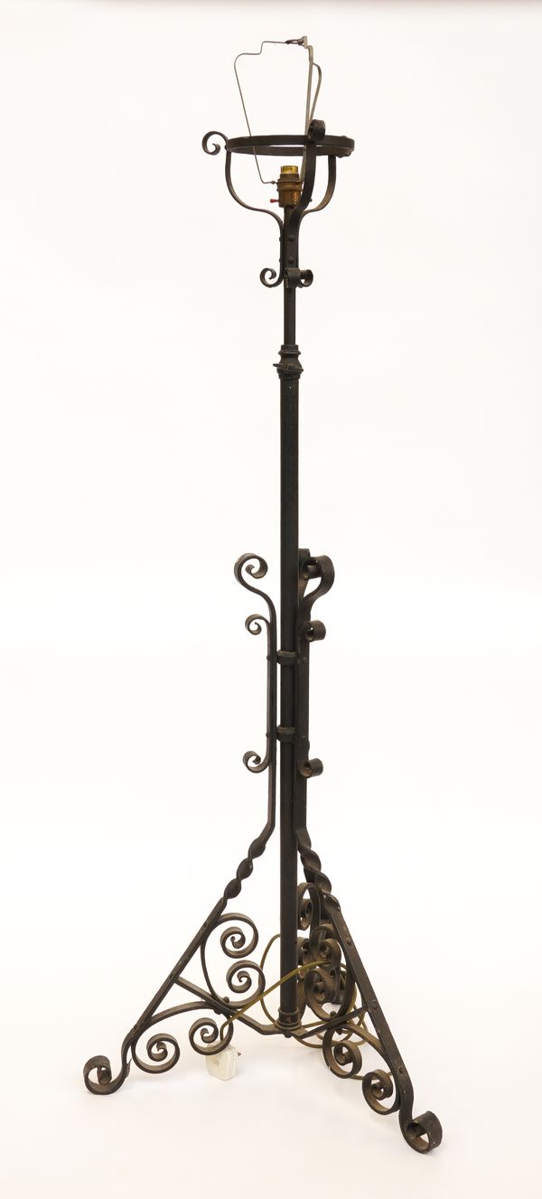 A BLACK  PAINTED WROUGHT IRON FLOOR STANDING LAMP