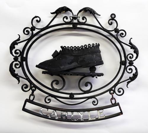 A WROUGHT IRON COBBLER’S HANGING SHOP SIGN