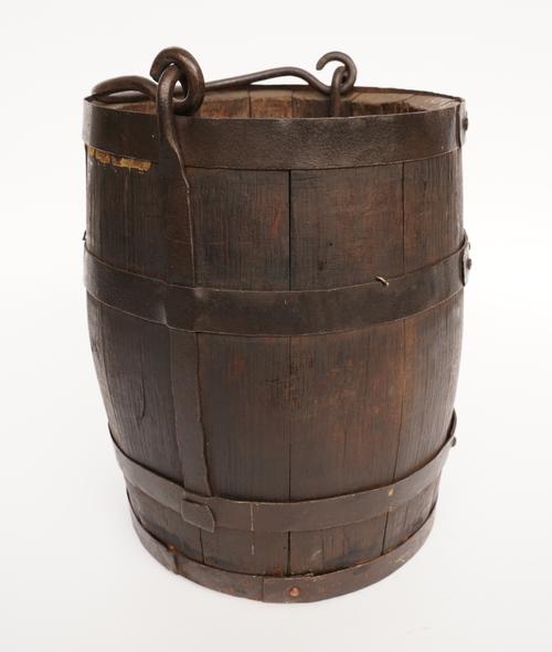 A WROUGHT IRON BOUND AND COOPERED BUCKET