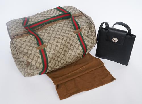 BVLGARI: A BLACK LEATHER SHOULDER BAG AND A GUCCI CANVAS DUFFLE BAG (2)