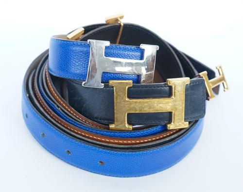 HERMES: FOUR BELT BUCKLES AND THREE LEATHER BELTS (4)