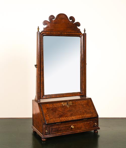 AN EARLY 18TH CENTURY INLAID WALNUT TOILET MIRROR WITH FITTED BASE