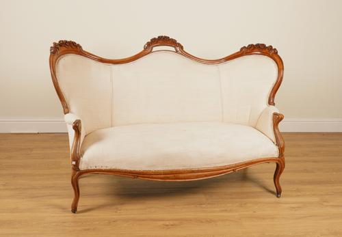 A VICTORIAN MAHOGANY FRAMED DOUBLE HUMP BACK SOFA