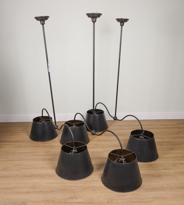 A SET OF THREE PATINATED METAL TWIN LIGHT HANGING LIGHTS (3)