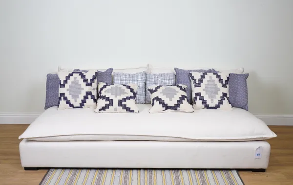 CUSHIONS, A GROUP OF TEN ASSORTED CUSHIONS IN NAVY BLUE AND CREAM (10)