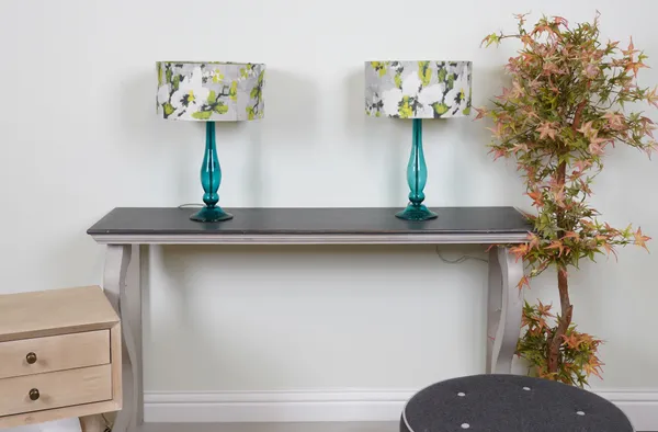 LIGHTING, A PAIR OF TURQUOISE GLASS TABLE LAMPS WITH FLORAL SHADES (2)