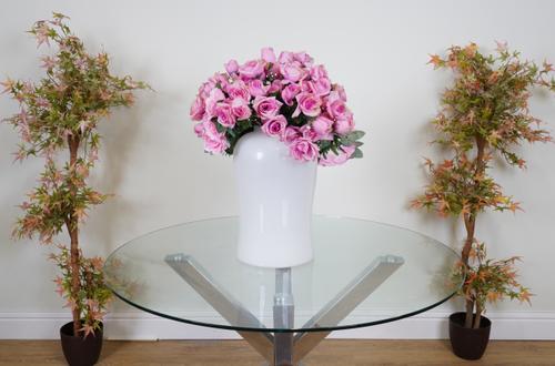 A SMALL BUNCH OF FAUX PINK ROSES