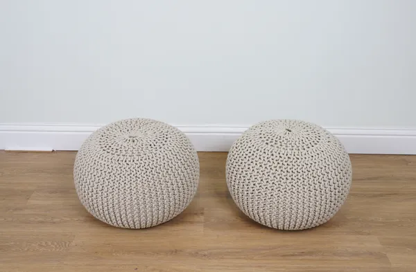 A PAIR OF COTTON UPHOLSTERED POUFFES (2)