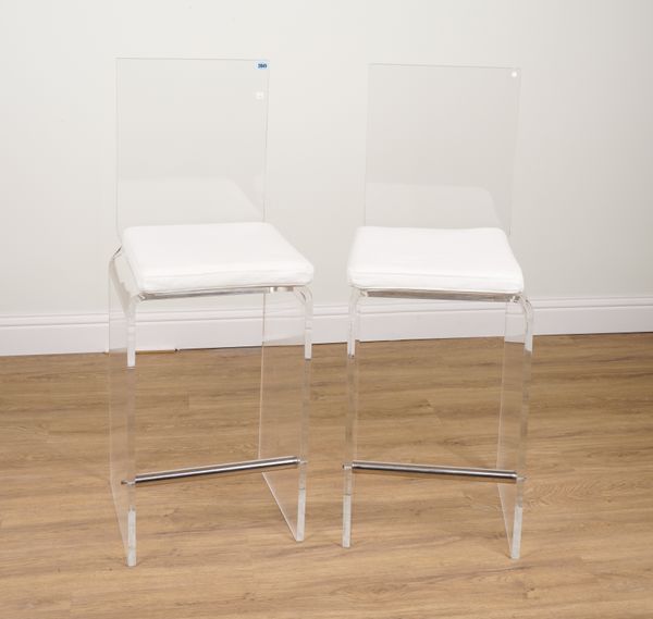 A PAIR OF ACRYLIC BAR STOOLS WITH WHITE LEATHER CUSHION SEATS