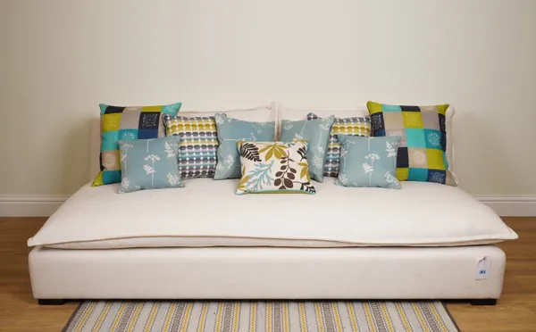 CUSHIONS, A GROUP OF NINE CUSHIONS IN BLUES AND GREENS