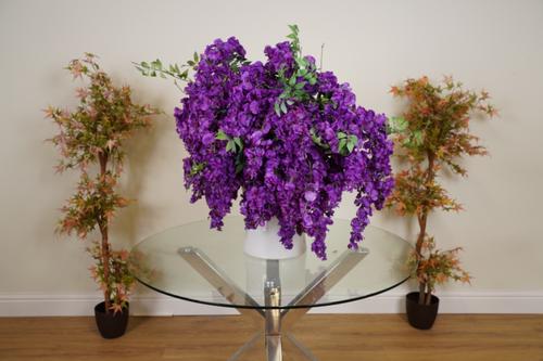 A LARGE BLOOM OF DEEP PURPLE FAUX WISTERIA