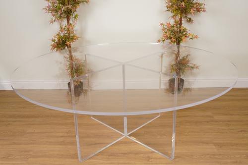 A LARGE CIRCULAR PERSPEX DINING TABLE WITH X-FRAME BASE
