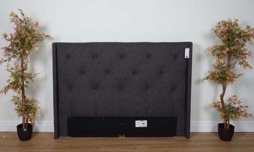 A DARK GREY UPHOLSTERED DOUBLE HEADBOARD