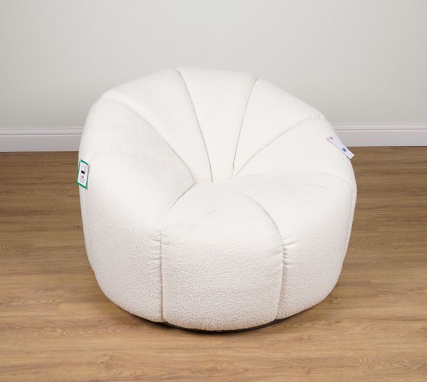 A LARGE CREAM WOOL UPHOLSTERED CHAIR