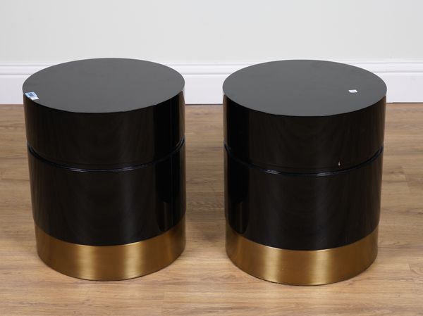 A PAIR OF BLACK LACQUER AND BRASS CYLINDRICAL BEDSIDE TABLES (2)