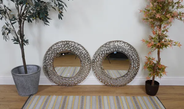 A PAIR OF SILVERED METAL CIRCULAR WALL MIRRORS (2)