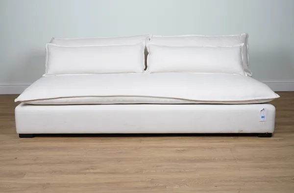 A LARGE CREAM COTTON UPHOLSTERED ARMLESS SOFA