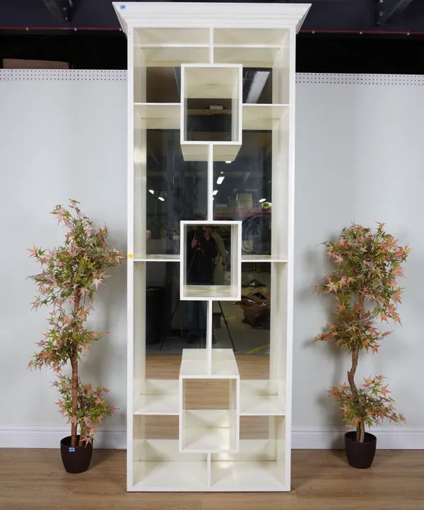 A WHITE PAINTED OPEN BOOKCASE