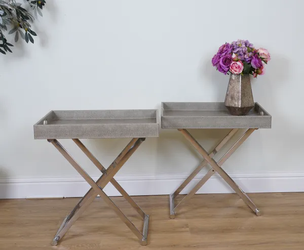 A PAIR OF CHROME AND FAUX LEATHER TRAY TOP TABLES