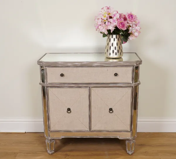 A SILVER PAINTED AND CREAM UPHOLSTERED SIDE CABINET