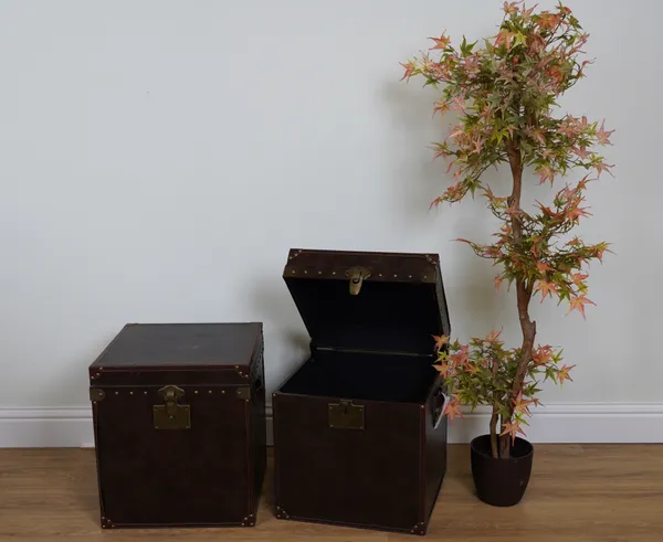 A PAIR OF FAUX BROWN LEATHER LIFT TOP TRUNKS (2)