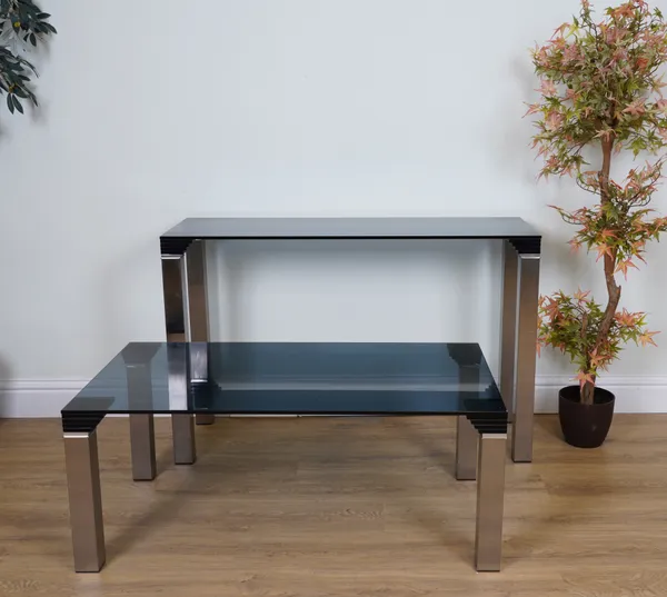 A BRUSHED STEEL AND GLASS SIDE TABLE (2)