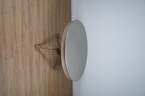 A GREEN PAINTED CIRCULAR DINING TABLE