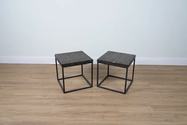 A PAIR OF HARDWOOD AND BLACK METAL SQUARE SIDE TABLES (2)