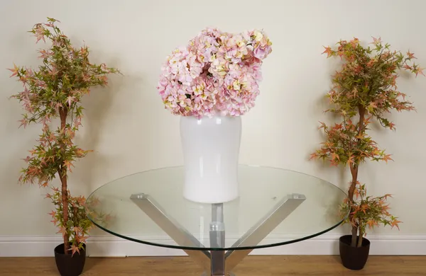 A LARGE BOUQUET OF FAUX PINK HYDRANGEAS