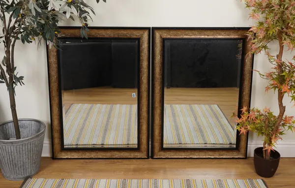 A PAIR OF BLACK AND GOLD PAINTED RECTANGULAR WALL MIRRORS (2)