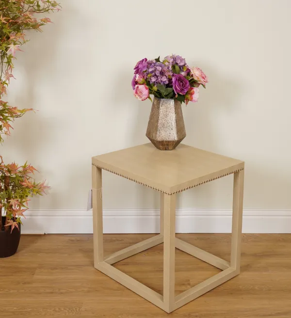 A MODERN FAUX LEATHER UPHOLSTERED SIDE TABLE