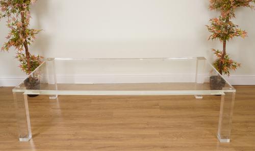 A PERSPEX RECTANGULAR COFFEE TABLE