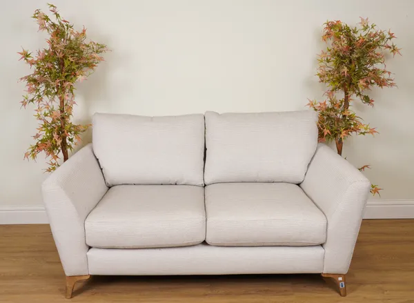 A MODERN TWO SEATER SOFA