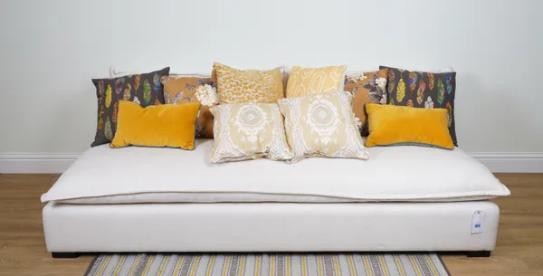 CUSHIONS, A GROUP OF TEN CUSHIONS MAINLY IN MUSTARD YELLOW