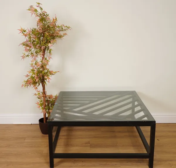 A BLACK PAINTED HARDWOOD AND GLASS COFFEE TABLE