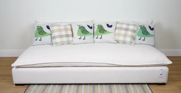 CUSHIONS, A GROUP OF SIX CUSHIONS IN PALE GREEN AND BLUES (6)