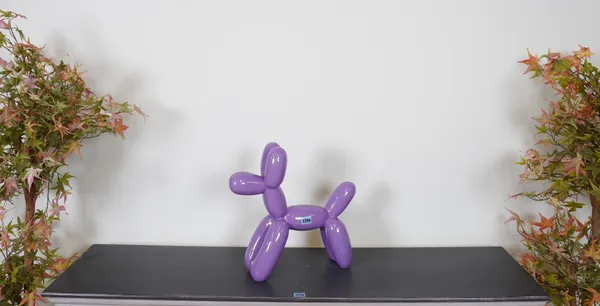 AFTER JEFF KOONS, A MODERN PURPLE FAUX BALLOON MODEL OF A DOG