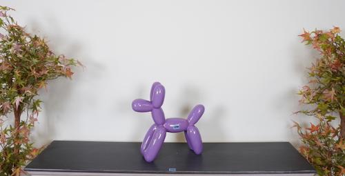 AFTER JEFF KOONS, A MODERN PURPLE FAUX BALLOON MODEL OF A DOG