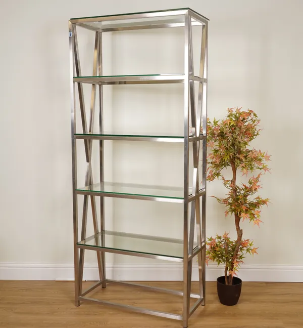 A BRUSHED STEEL AND GLASS FIVE TIER OPEN BOOKCASE