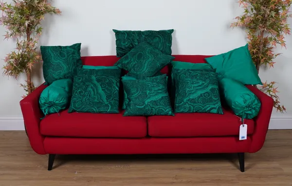 CUSHIONS, A GROUP OF FIFTEEN IN GREEN, INCLUDING MALACHITE PATTERN EXAMPLES (15)