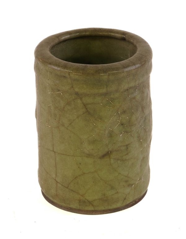 A CHINESE CELADON GLAZED CYLINDRICAL BRUSH POT